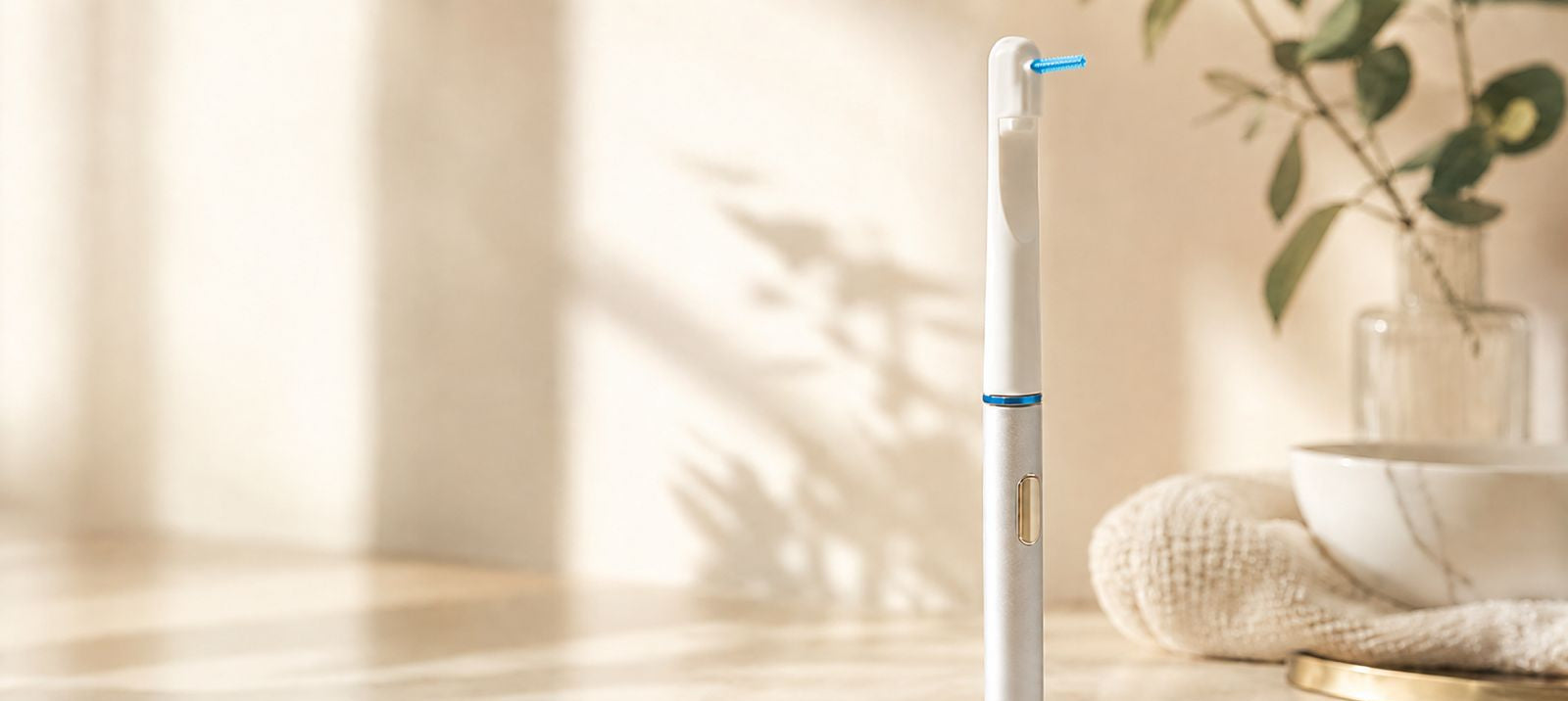 AeroFloss Pro sonic electric flosser with interdental tip mounted