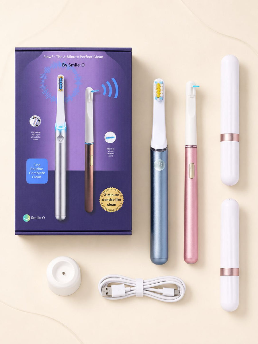 Flow kit box contents laid out: AeroFloss Pro, AeroBrush Pro, tips, brush heads, cases, and charging cable